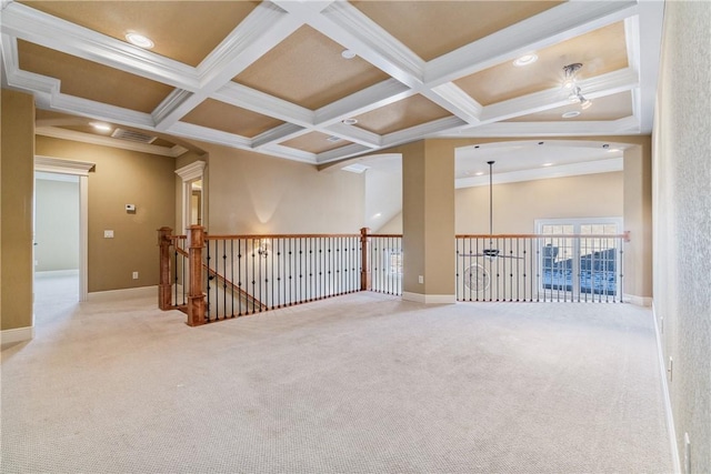 empty room featuring beam ceiling, crown molding, and coffered ceiling