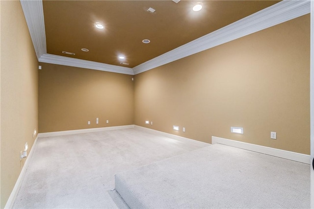 carpeted spare room with crown molding