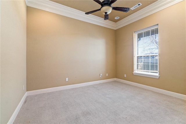 carpeted empty room with ceiling fan and ornamental molding