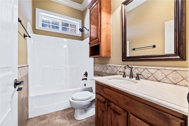 full bathroom with crown molding, vanity, bathtub / shower combination, and toilet