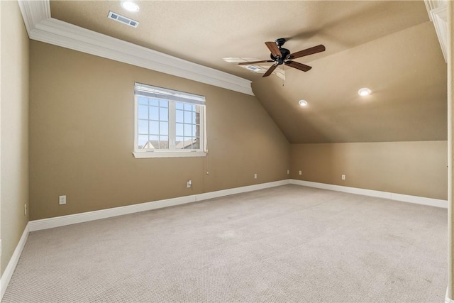 bonus room with light colored carpet, vaulted ceiling, and ceiling fan