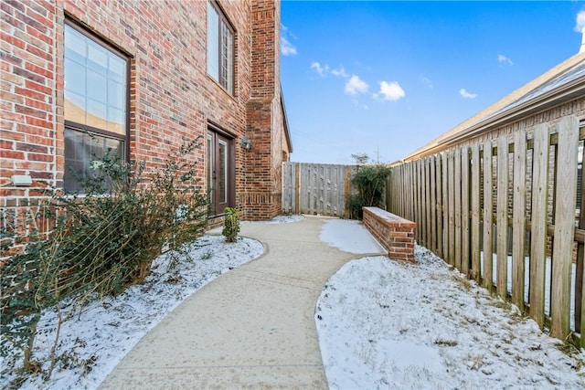 view of yard layered in snow