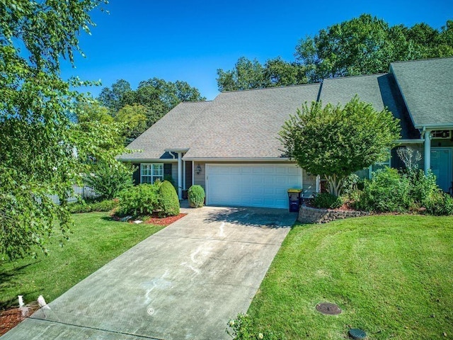 view of front facade with a front lawn and a garage