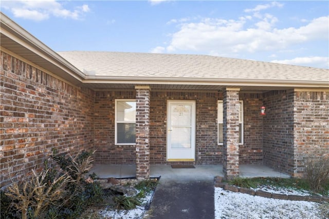 entrance to property featuring covered porch