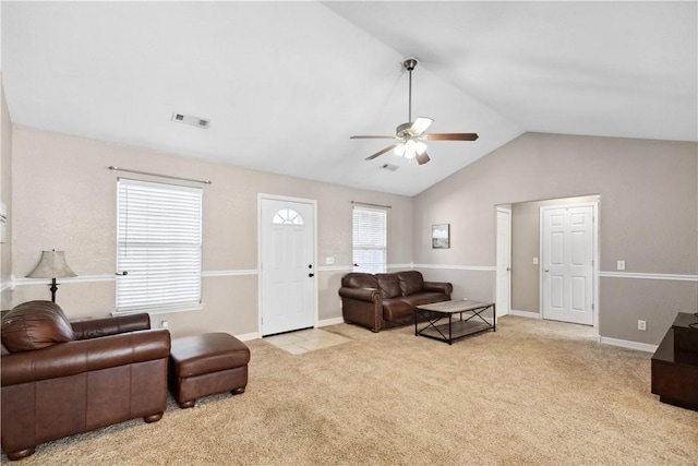 carpeted living room with vaulted ceiling and ceiling fan