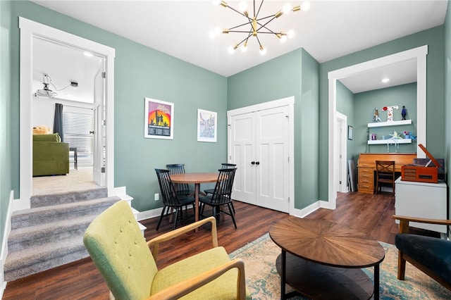 dining area with a notable chandelier, baseboards, and dark wood-style flooring