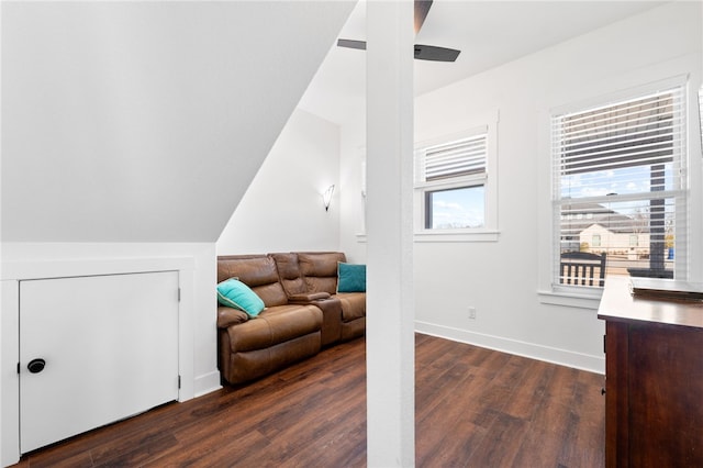 living room with dark wood finished floors and baseboards