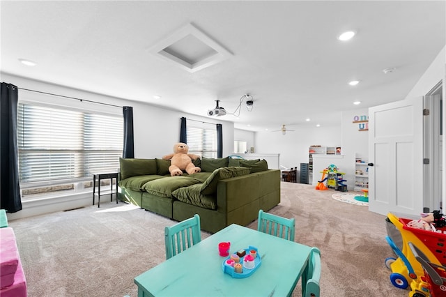 interior space with recessed lighting and attic access