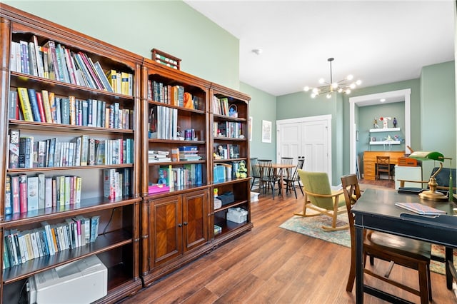 interior space featuring a chandelier and wood finished floors