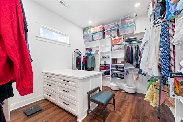 walk in closet with visible vents and dark wood-style floors