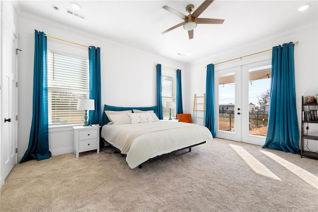 carpeted bedroom featuring visible vents, ornamental molding, french doors, a ceiling fan, and access to outside