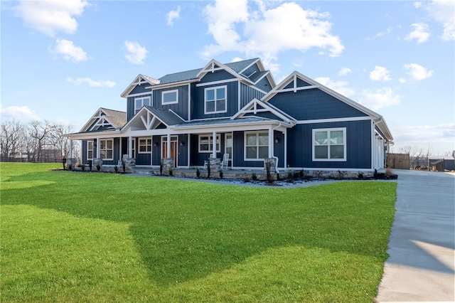 craftsman house with covered porch, board and batten siding, and a front lawn