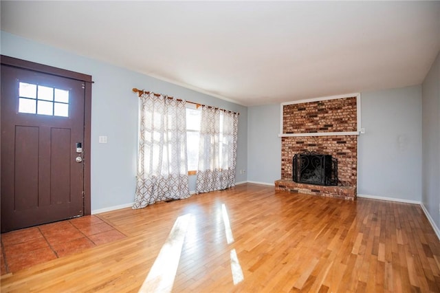 interior space featuring a fireplace and hardwood / wood-style flooring