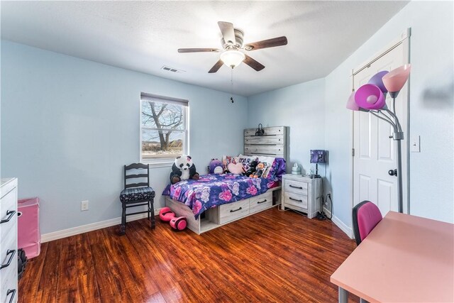 bedroom featuring ceiling fan and dark hardwood / wood-style floors