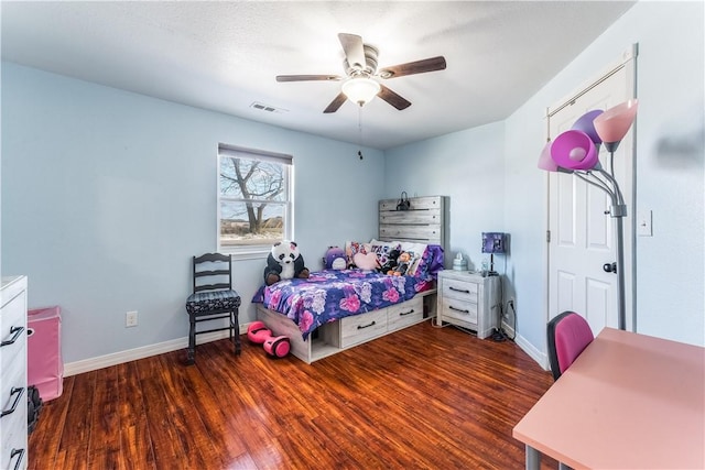 bedroom featuring dark hardwood / wood-style flooring and ceiling fan