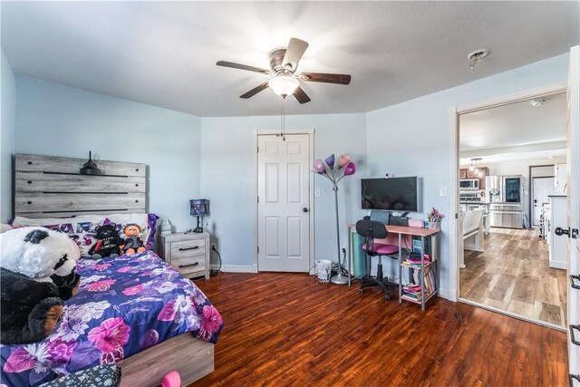 bedroom with hardwood / wood-style floors and ceiling fan