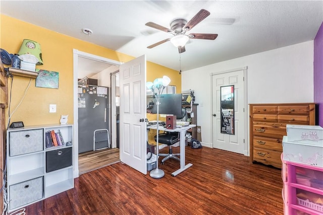 interior space with dark hardwood / wood-style floors, stainless steel fridge, and ceiling fan