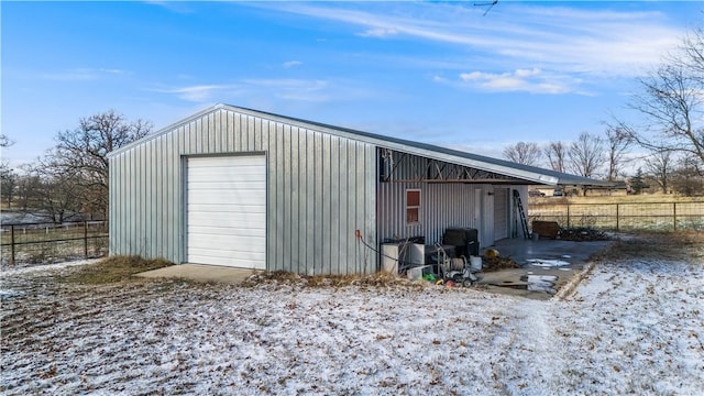 view of snow covered garage