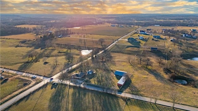 aerial view at dusk with a rural view