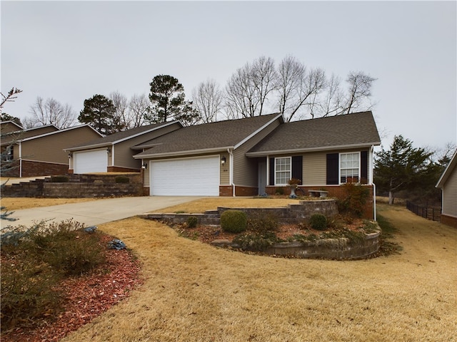 ranch-style home with a garage and a front yard