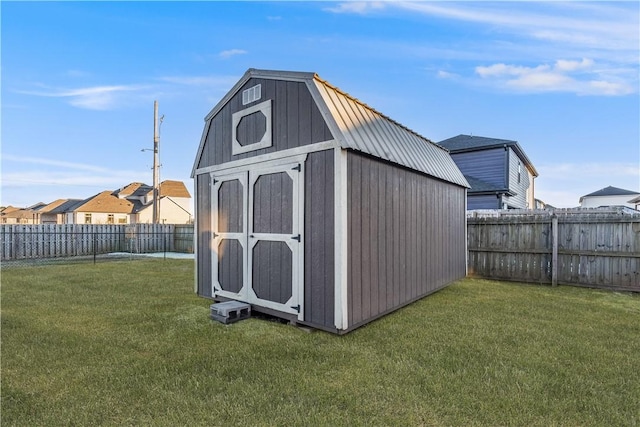 view of shed with a residential view and a fenced backyard