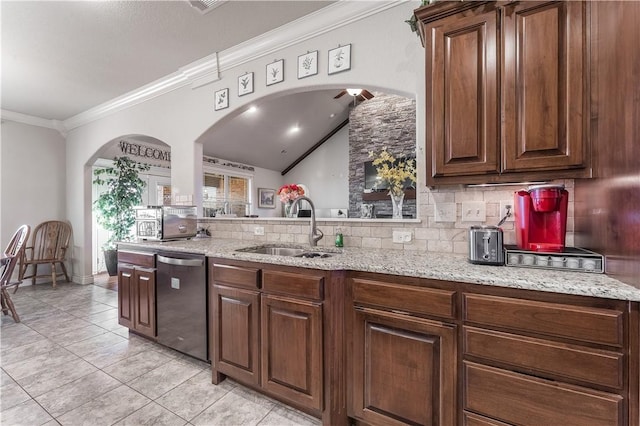 kitchen with dishwasher, ornamental molding, a sink, light stone countertops, and backsplash