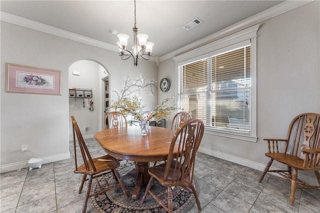 tiled dining room featuring arched walkways, crown molding, visible vents, an inviting chandelier, and baseboards