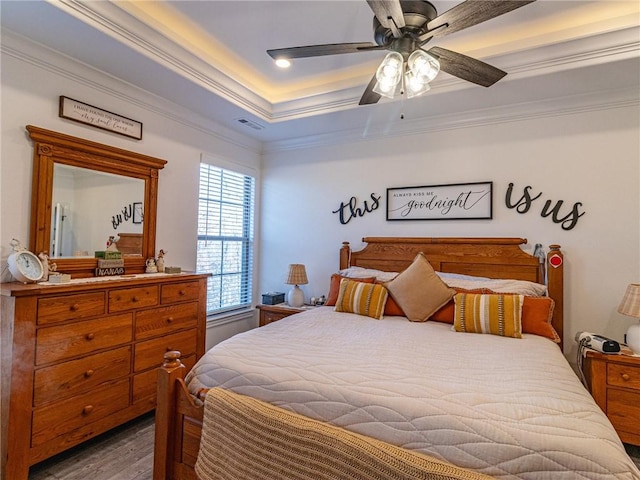 bedroom featuring ceiling fan, dark hardwood / wood-style floors, and ornamental molding