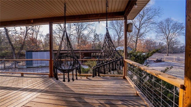 wooden terrace with a water view