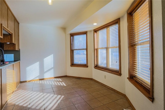 kitchen with light tile patterned floors