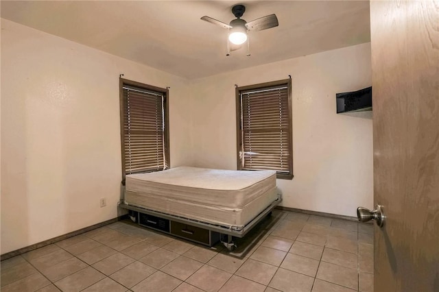 bedroom featuring ceiling fan and light tile patterned floors