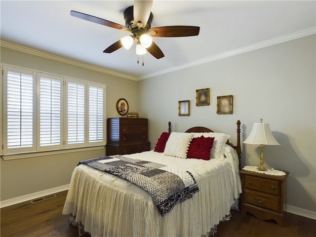 bedroom featuring visible vents, ornamental molding, baseboards, and dark wood-style flooring