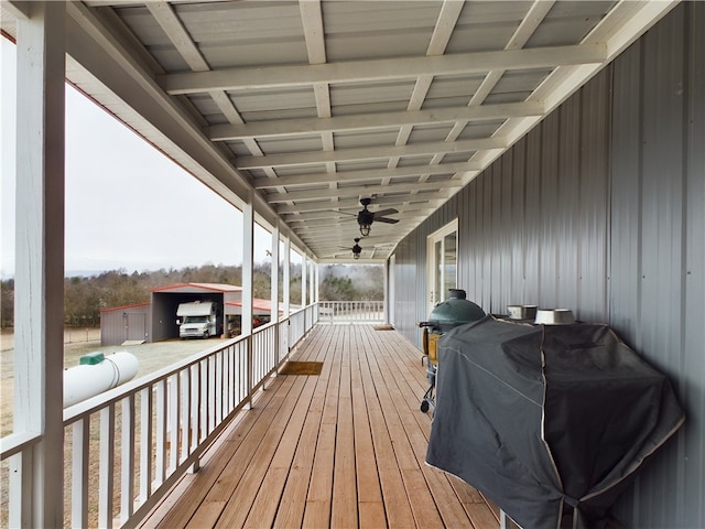 wooden terrace featuring ceiling fan