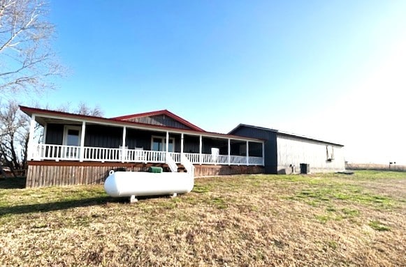 back of property featuring a porch