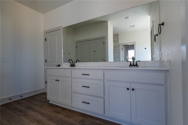 bathroom featuring vanity and hardwood / wood-style flooring