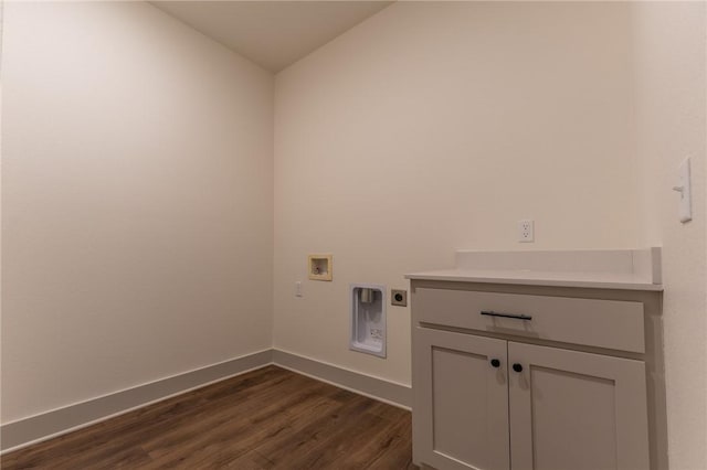 laundry room with electric dryer hookup, cabinets, dark wood-type flooring, and hookup for a washing machine