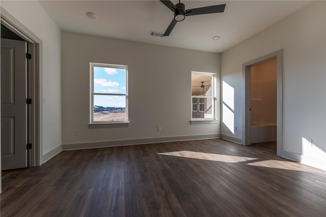 empty room featuring dark hardwood / wood-style floors and ceiling fan