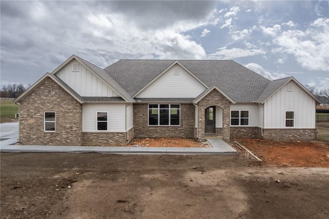 13121 Bethel Blacktop Rd, Farmington, AR 72730 - craftsman-style home with brick siding, board and batten siding, and roof with shingles