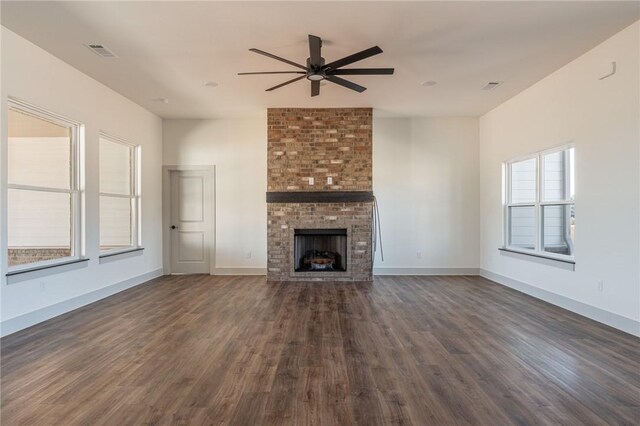 13121 Bethel Blacktop Rd, Farmington, AR 72730 - unfurnished living room with dark wood-style floors, a fireplace, baseboards, and ceiling fan