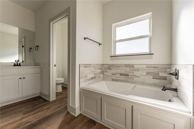 13121 Bethel Blacktop Rd, Farmington, AR 72730 - full bath with wood finished floors, toilet, a bath, and vanity