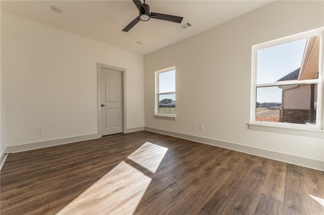 13121 Bethel Blacktop Rd, Farmington, AR 72730 - unfurnished room featuring visible vents, a ceiling fan, dark wood-type flooring, and baseboards