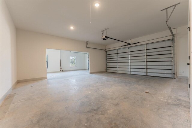 13121 Bethel Blacktop Rd, Farmington, AR 72730 - garage with baseboards and a garage door opener