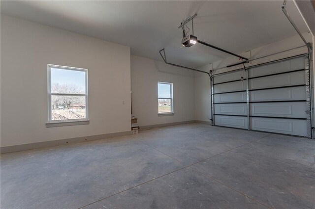 13121 Bethel Blacktop Rd, Farmington, AR 72730 - garage featuring baseboards and a garage door opener
