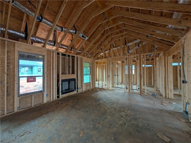 unfurnished living room with lofted ceiling