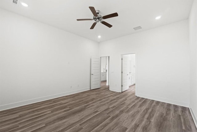 unfurnished bedroom with visible vents, dark wood-type flooring, baseboards, recessed lighting, and a ceiling fan