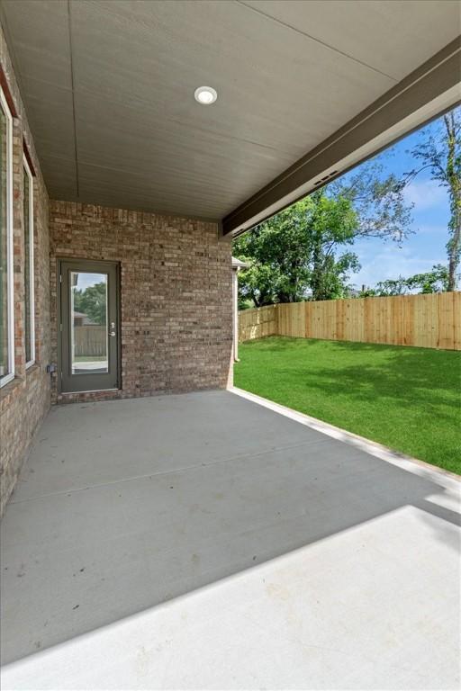 view of patio / terrace featuring fence