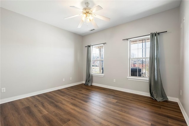 unfurnished room featuring dark hardwood / wood-style floors and ceiling fan