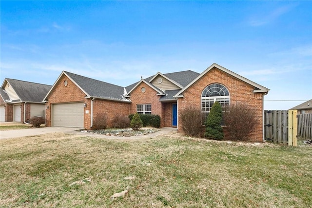 view of front of property with a garage and a front yard