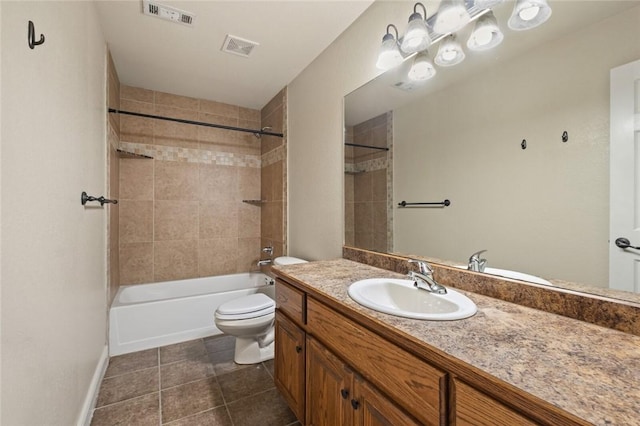 full bathroom featuring vanity, toilet, and tiled shower / bath