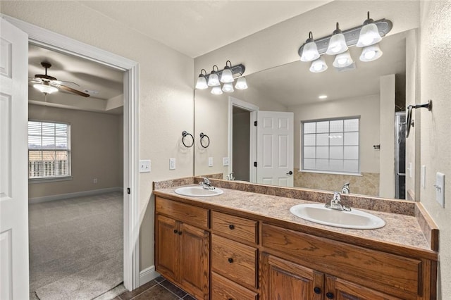 bathroom with tile patterned floors, ceiling fan, and vanity